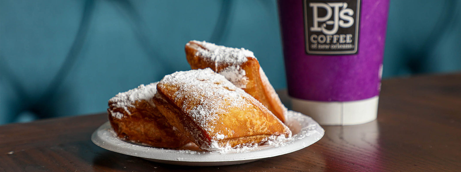 Cup of coffee and a breakfast dessert from PJ's Coffee of New Orleans.